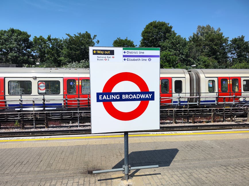 A close-up of a sign for Hyde Park Corner at Tufnell Park tube station, mounted on a dark green surface beneath a beige panel and a metallic structural element. The sign features a white background wi